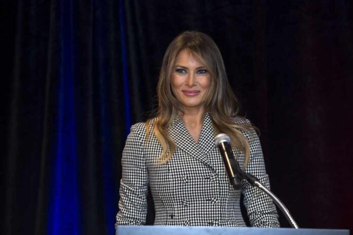 2048px-Melania_Trump_reacts_to_applause_during_her_speech_to_Team_USA_(37247815882) (1)