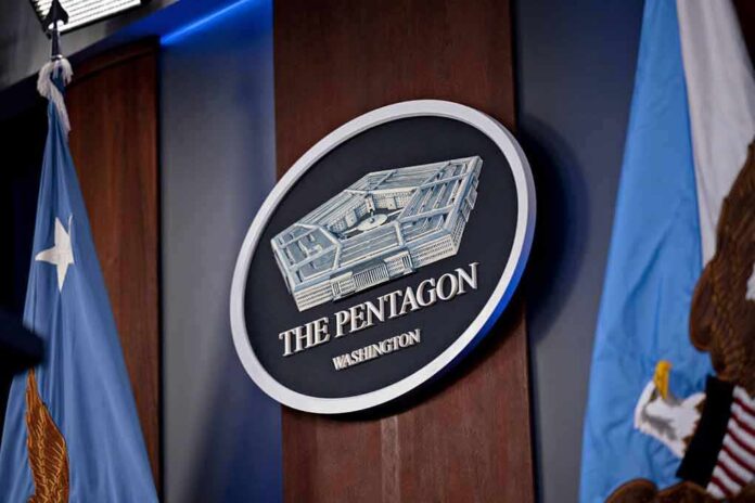 2265798341 featured image Pentagon sign flanked by flags, Washington, D.C.