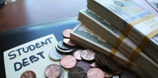 Note with student debt, coins, and banknotes