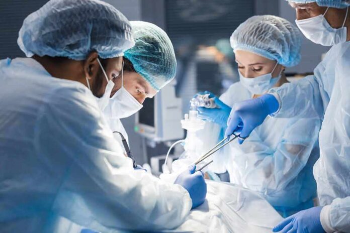 1265400856 featured image Doctors performing surgery in an operating room
