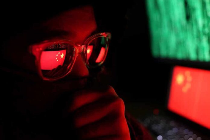 1339292228 featured image Person with glasses reflecting Chinese flag and computer screens