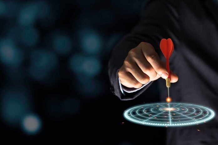 1722840469 featured image Hand aiming dart at digital target