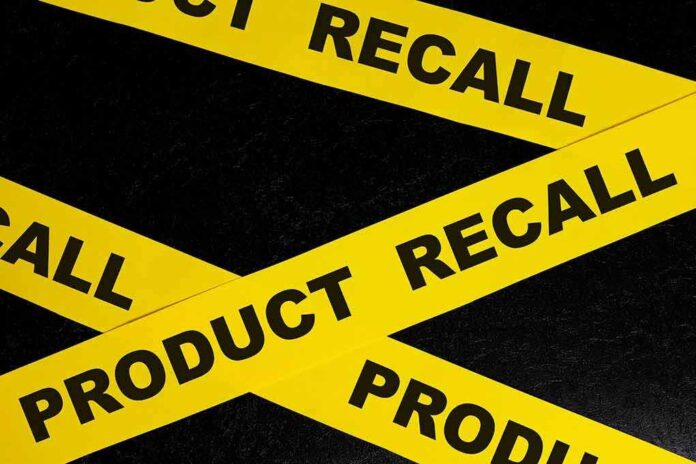 2263803439 featured image Yellow product recall tape on black background
