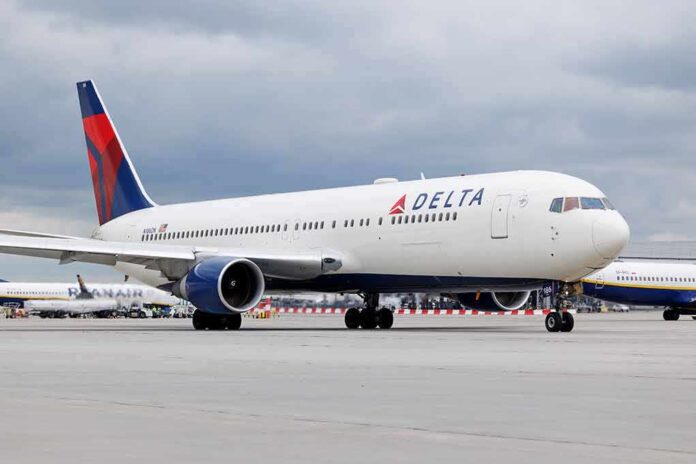 2305553471 featured image Delta Airlines airplane on airport runway, cloudy sky