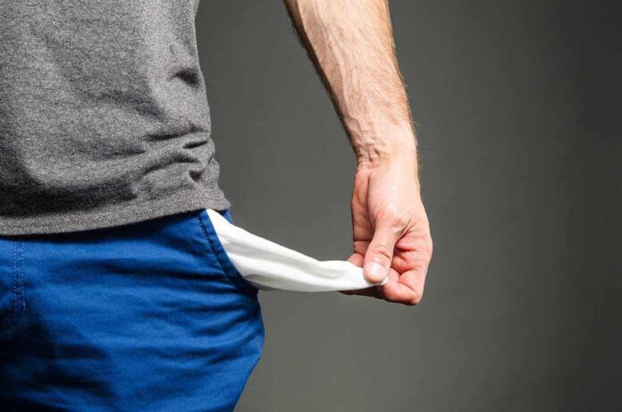 318205070 featured image Person pulling out empty pocket from shorts.