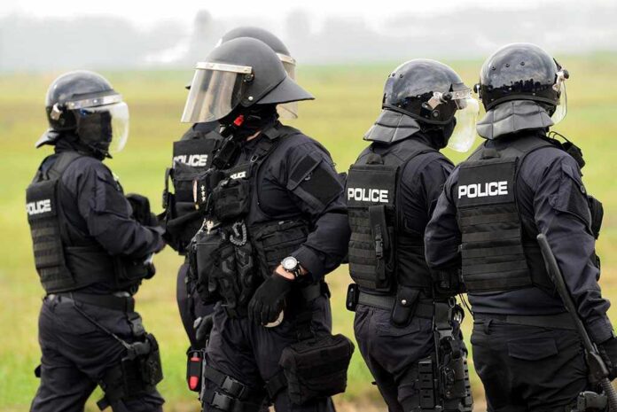 498487594 featured image Police officers in tactical gear standing together outdoors