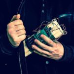 Person holding a homemade explosive device