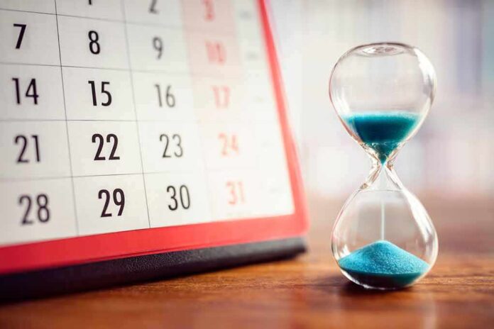 767539465 featured image Calendar and hourglass with blue sand