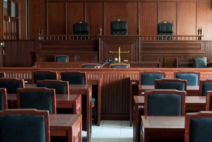 Empty courtroom with wooden furnishings and judge s bench