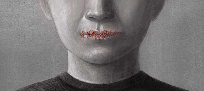 Mouth stitched shut with red thread