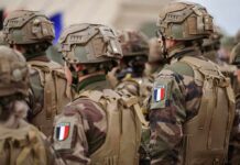 Soldiers in camouflage with French flag patches