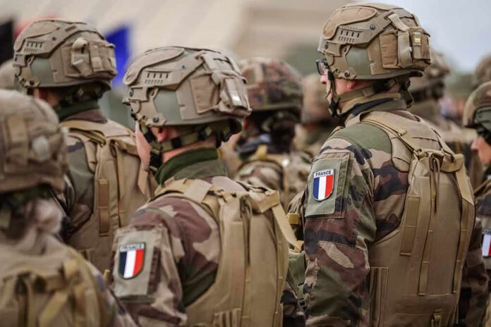 2155320783 featured image Soldiers in camouflage with French flag patches