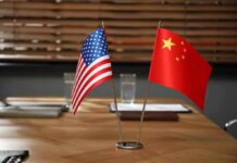 American and Chinese flags on a conference table