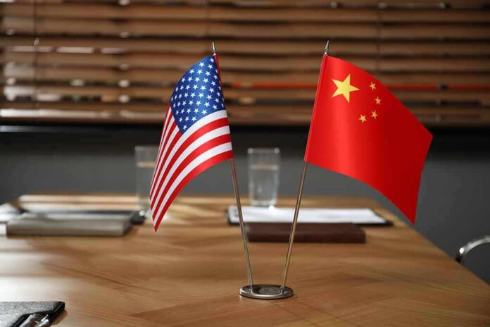 2183327065 featured image American and Chinese flags on a conference table