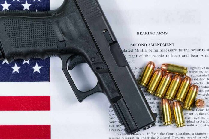359759447 featured image Gun and bullets on Second Amendment document
