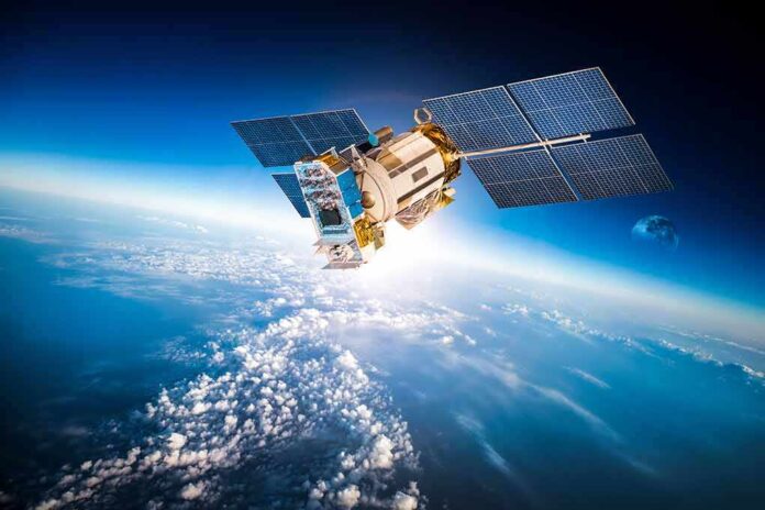 Satellite orbiting Earth with moon in background