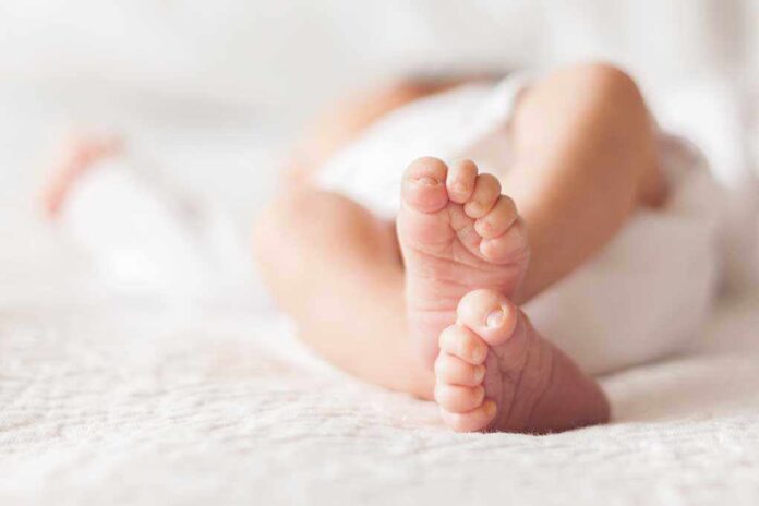 1111986902 featured image Close up of baby feet lying on blanket