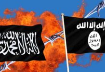 Two black flags with Arabic writing flames background