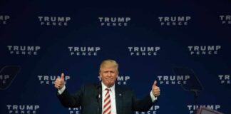 Man giving thumbs up at Trump Pence rally