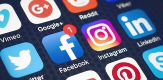 Social media app icons on a smartphone screen