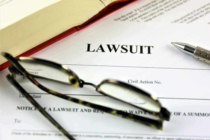 775833220 featured image Lawsuit paperwork with glasses pen and an open book