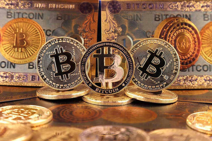 Bitcoin coins and bills displayed closely