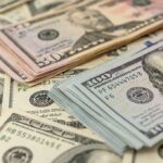 Stacks of various U.S. dollar bills