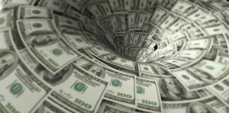 Hundred-dollar bills swirling into a financial vortex