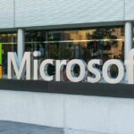 Microsoft logo displayed outside a modern office building