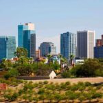 Skyline of Phoenix with modern buildings and desert landscape in the foreground