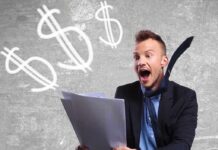 Excited businessman holding documents with dollar signs in the background