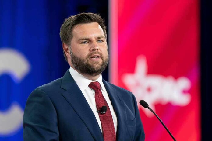 A man in a suit speaking at a podium during a conference