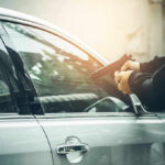 Mafia’s Brazen Attack on Journalist Person pointing gun at car window