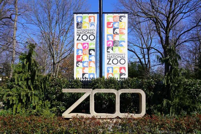 Entrance sign of the Smithsonian National Zoo with colorful animal graphics