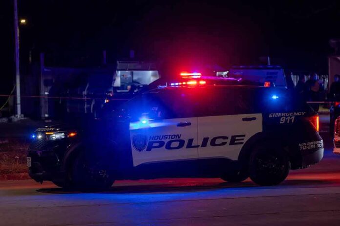 Houston police vehicle with emergency lights activated at night