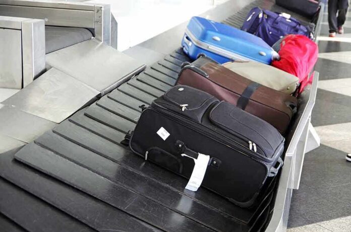 Various suitcases on an airport luggage carousel