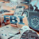 FBI text surrounded by digital security graphics and hands