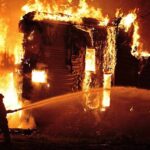 Grandfather CHARGES Into Flames — What Happened Next A firefighter battling a large house fire at night