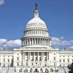 Congresswoman’s Husband’s Net Worth SOARS in ONE YEAR! U.S. Capitol building against blue sky.