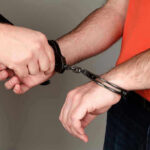 Two More Commie Agitators Arrested for Ambushing Church Person handcuffing another persons wrists