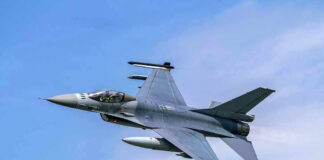 France Blocks U.S. Bombers – Shuts Airspace! Jet fighter flying through clear blue sky.