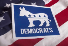 Dems Triple Own Pay – Party of HYPOCRITES! Democrats logo on American flag background