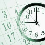 A clock overlaying a calendar, illustrating the concept of time management