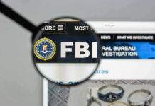FBI website shown through magnifying glass.
