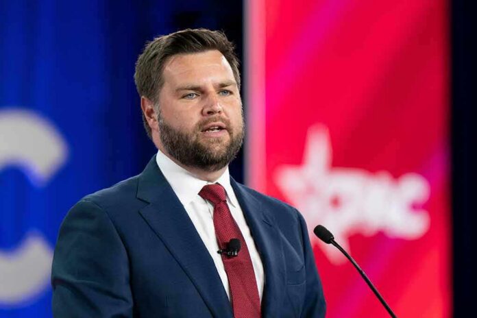 A man in a suit delivering a speech at a conference