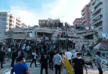 Israel Targets Hamas Chief – Did They Hit? People at a collapsed building after an earthquake.