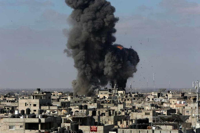 Large explosion over a crowded urban area.