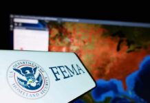 Trump’s FEMA Rewrite Tests States FEMA logo near a US map on screen.