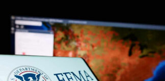 Trump’s FEMA Rewrite Tests States FEMA logo near a US map on screen.