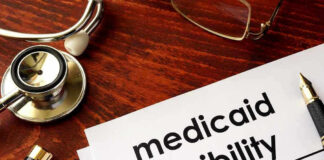 Medicaid Kickbacks, Fake Trips—Taxpayers Fleeced Stethoscope pen document about Medicaid eligibility on table